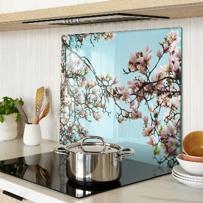 Planche à découper en verre Fleurs de magnolia sur fond bleu