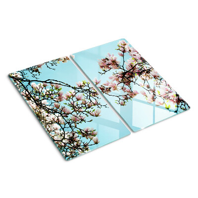 Planche à découper en verre Fleurs de magnolia sur fond bleu
