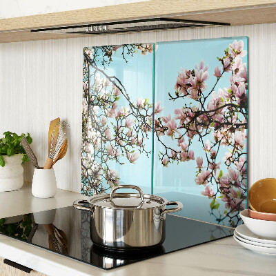 Planche à découper en verre Fleurs de magnolia sur fond bleu