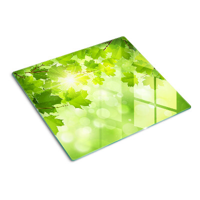 Planche à découper en verre Feuilles aux rayons du soleil