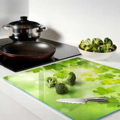 Planche à découper en verre Feuilles aux rayons du soleil