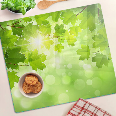 Planche à découper en verre Feuilles aux rayons du soleil