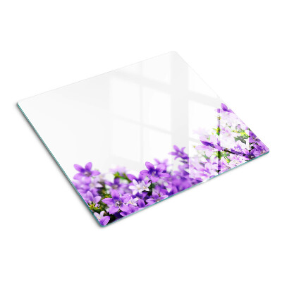 Planche à découper en verre Fleurs violettes en arrière-plan