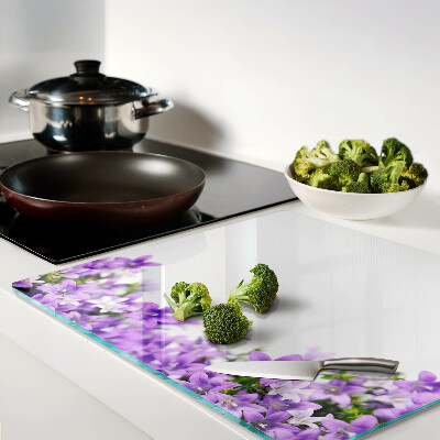 Planche à découper en verre Fleurs violettes en arrière-plan