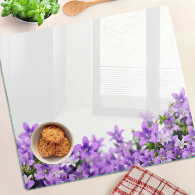 Planche à découper en verre Fleurs violettes en arrière-plan