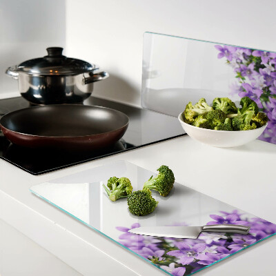 Planche à découper en verre Fleurs violettes en arrière-plan