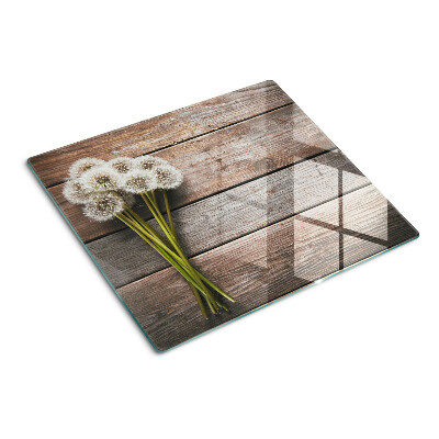 Planche à découper en verre Fleurs de pissenlit sur fond de bois