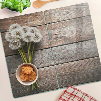 Planche à découper en verre Fleurs de pissenlit sur fond de bois