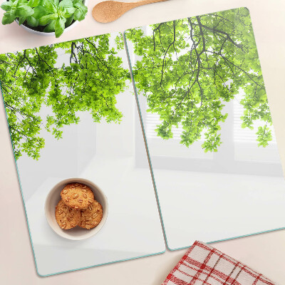 Planche à découper en verre Feuilles vertes contre le ciel