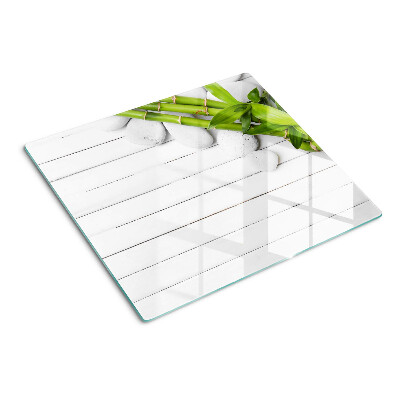 Planche à découper en verre Bambou et pierres sur fond de bois
