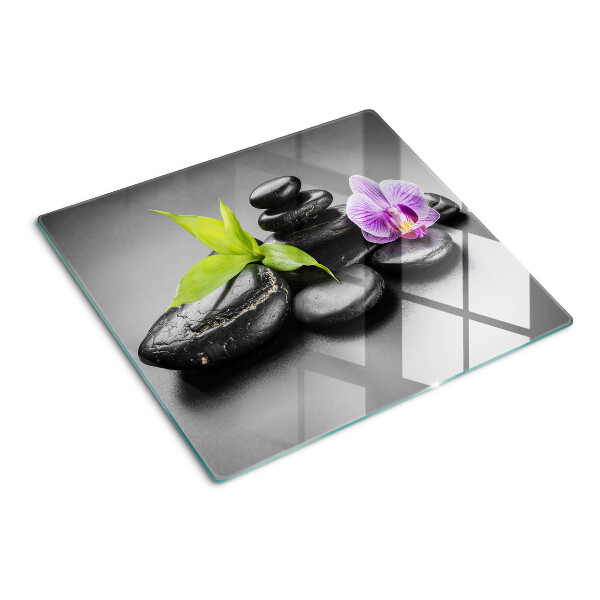 Planche à découper en verre Pierres et orchidées en arrière-plan