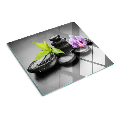Planche à découper en verre Pierres et orchidées en arrière-plan