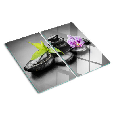 Planche à découper en verre Pierres et orchidées en arrière-plan