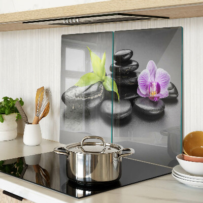 Planche à découper en verre Pierres et orchidées en arrière-plan