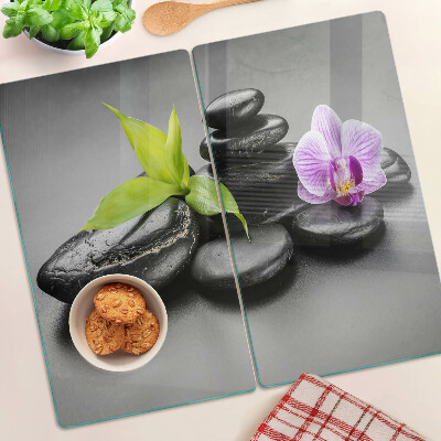 Planche à découper en verre Pierres et orchidées en arrière-plan