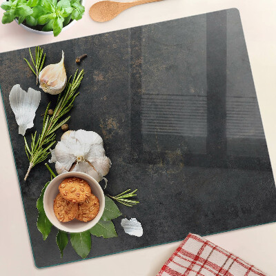 Planche à découper verre Fleurs et herbes sur fond de marbre