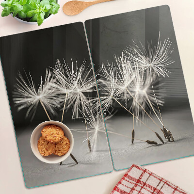Planche à découper en verre Pissenlits duveteux sur un fond monochrome
