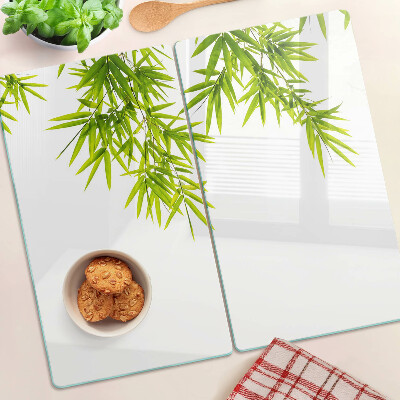 Planche à découper verre Feuilles de bambou sur le fond de la fenêtre