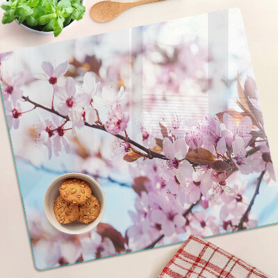 Planche à découper en verre Fleurs de cerisier sur fond bleu