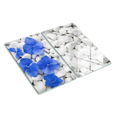 Planche à découper verre Fleurs bleues sur pierres blanches