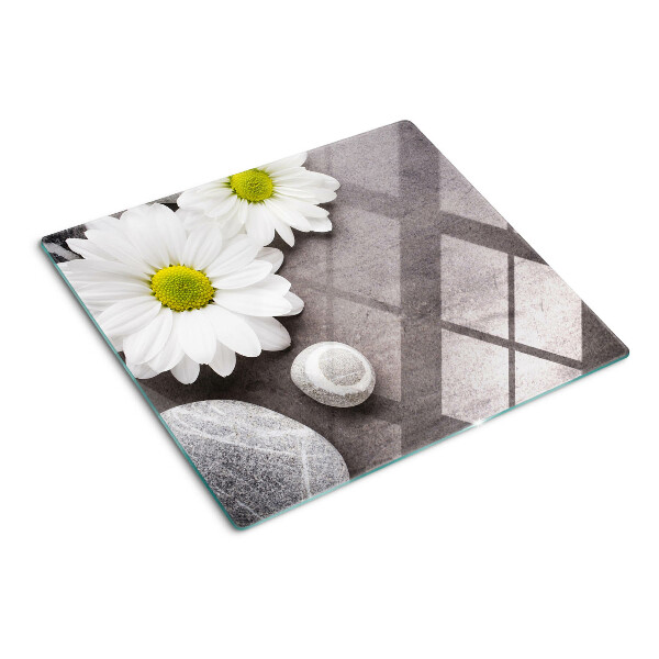Planche à découper verre Fleurs et pierres en arrière-plan