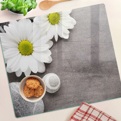 Planche à découper verre Fleurs et pierres en arrière-plan