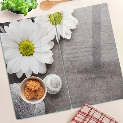 Planche à découper verre Fleurs et pierres en arrière-plan