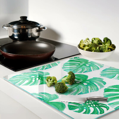 Planche à découper en verre Feuilles de Monstera sur fond blanc