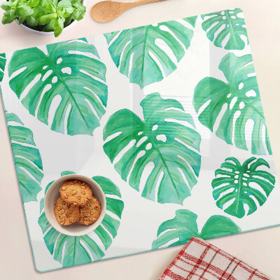 Planche à découper en verre Feuilles de Monstera sur fond blanc