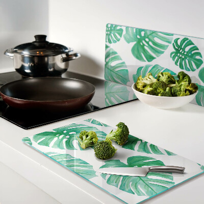Planche à découper en verre Feuilles de Monstera sur fond blanc