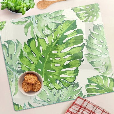 Planche à découper en verre Feuilles de Monstera sur fond clair