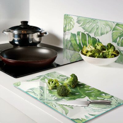 Planche à découper en verre Feuilles de Monstera sur fond clair