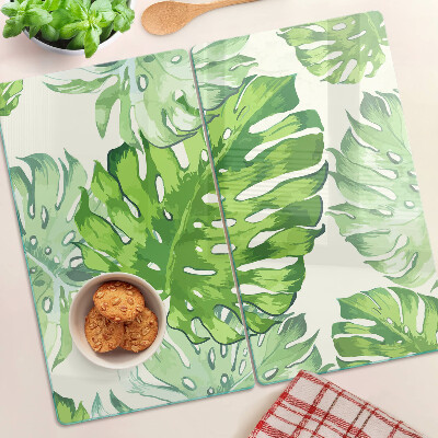 Planche à découper en verre Feuilles de Monstera sur fond clair