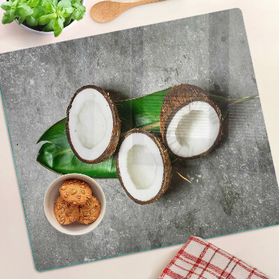 Planche à découper en verre Noix de coco sur fond de béton