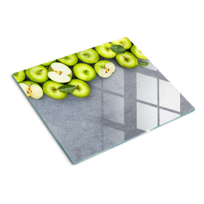 Planche à découper verre Pommes vertes sur une surface grise