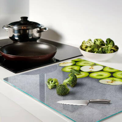 Planche à découper verre Pommes vertes sur une surface grise