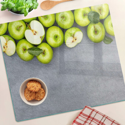 Planche à découper verre Pommes vertes sur une surface grise