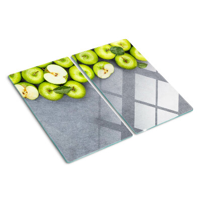 Planche à découper verre Pommes vertes sur une surface grise