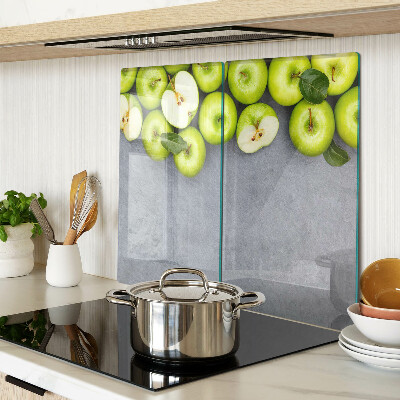 Planche à découper verre Pommes vertes sur une surface grise