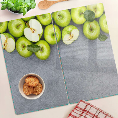 Planche à découper verre Pommes vertes sur une surface grise