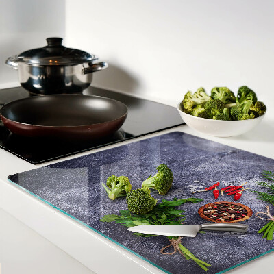 Planche à découper en verre Herbes et épices sur fond de pierre
