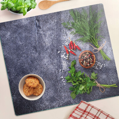 Planche à découper en verre Herbes et épices sur fond de pierre