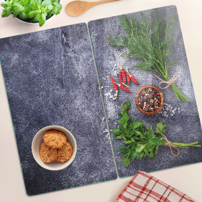 Planche à découper en verre Herbes et épices sur fond de pierre