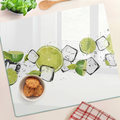 Planche à découper en verre Citrons avec de la glace dans l'eau