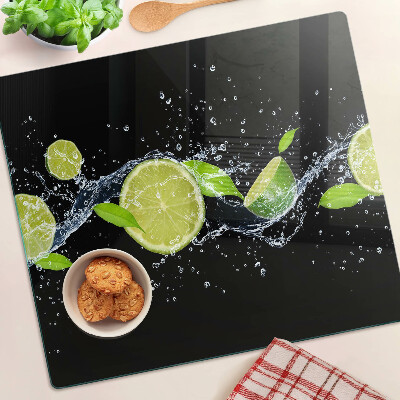 Planche à découper verre Citrons dans l'eau avec des feuilles de menthe