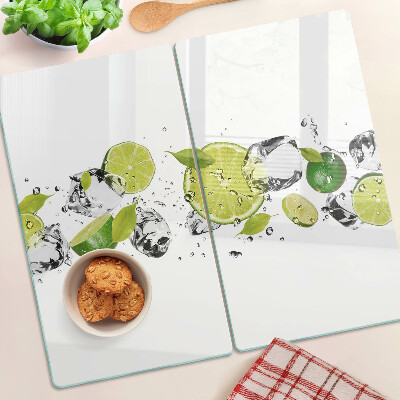 Planche à découper en verre Citrons et glace dans l'eau