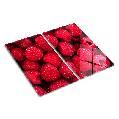 Planche à découper verre Des framboises en arrière-plan