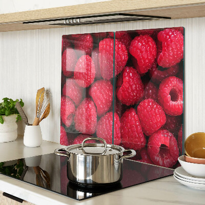 Planche à découper verre Des framboises en arrière-plan