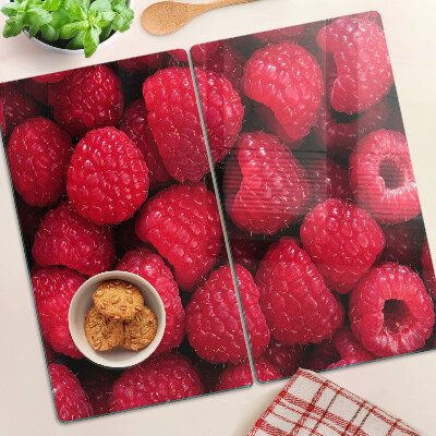Planche à découper verre Des framboises en arrière-plan