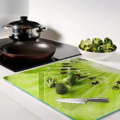 Planche à découper verre Kiwi avec des gouttes d'eau